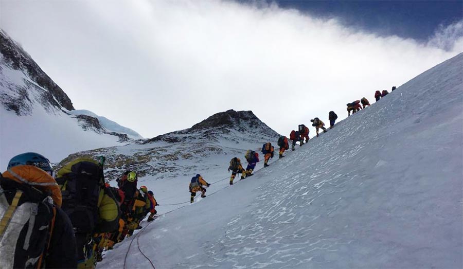 climbing Mt. Everest summit