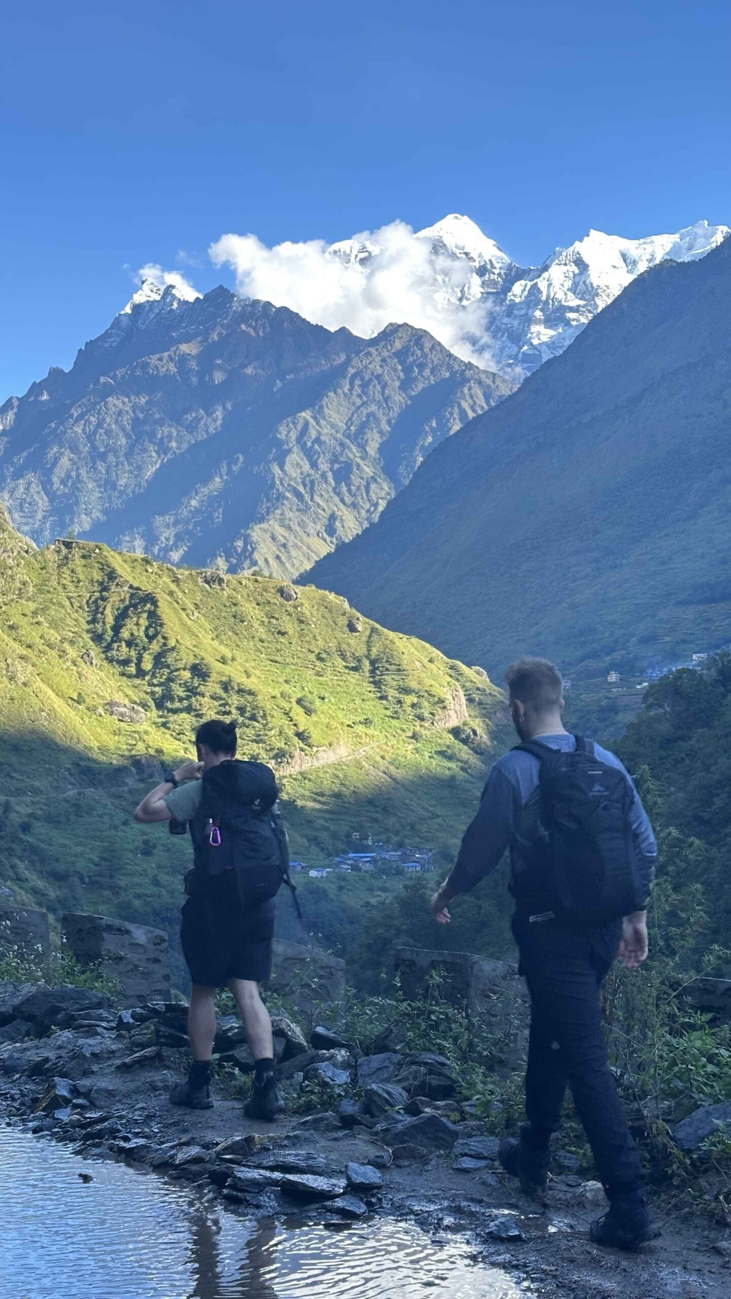 walking along side in manaslu circuit trail